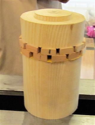 The start of her vase with a segmented top
